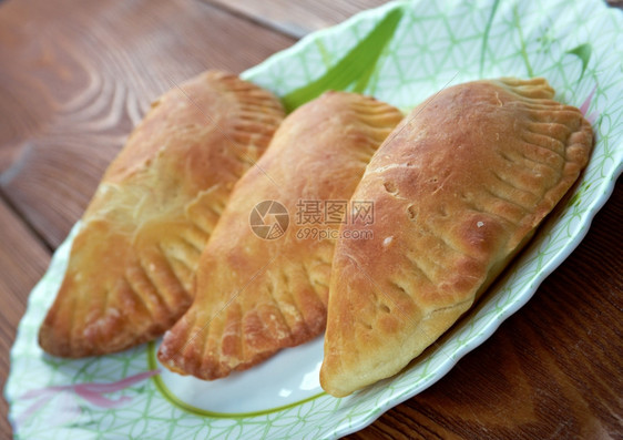 糊状团结的食物肉馅卷饼在拉丁美洲国西南部和东亚分地区的许多烘烤或油炸的阿根廷肉馅面包或糕点图片