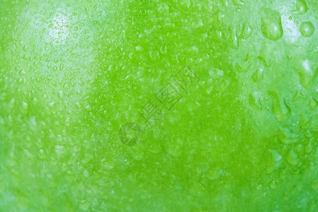 特写时水滴在绿苹果表面的背景上有质感饮食甜图片