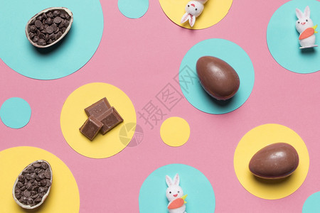 人们粉红背景高分辨率照片东面鸡蛋兔子巧克力芯片圆框架粉红色背景优质照片彩色背景高品质照片复活节织物图片