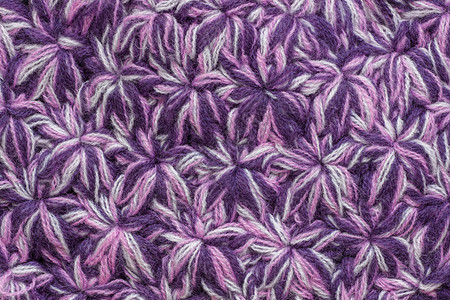 工艺外部纺织品毛线手工制作的丝状星体或彩色薄线雪花的针织物纹理图片