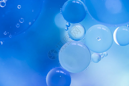 蓝色彩模糊背景的抽象泡美丽散焦优雅图片