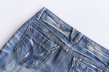服饰时髦尚戴尼姆蓝牛仔裤纹身的背面口袋缝合背景图片