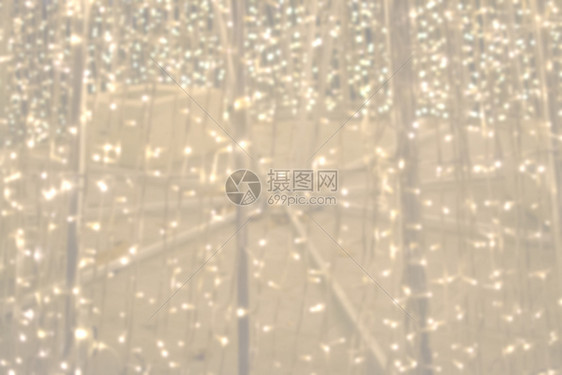 丰富多彩的派对冬天带灯串的抽象金色背景纹理夜背景带灯串的抽象金色背景纹理图片