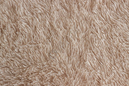 聚酯纤维合成的长堆米色可舒适家庭服装背景纹理等长堆的聚酯毛状抽象