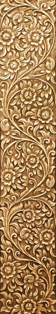 棕色的在木材背景上雕刻的花模式有质感的图片