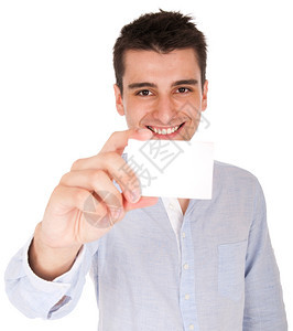 年轻的英俊纸带着空白卡的微笑着容年轻临时男子与白背景隔绝图片