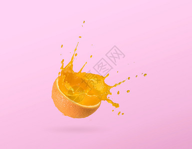 柑橘橙子切片汁喷洒在平原背景上隔离流动的热带图片