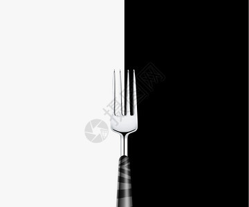 厨具国内的桌子白底和黑的尖锐金属叉图片