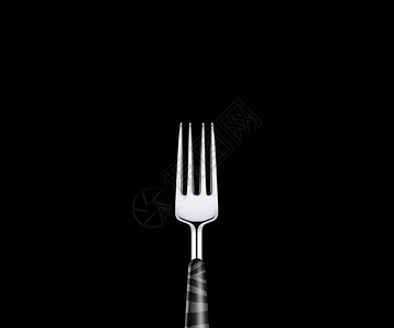 黑色底的尖锐金属叉厨房用餐银图片