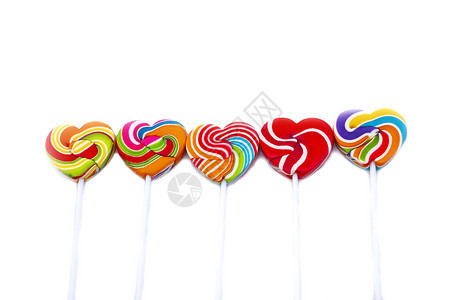 美丽的甜糖心形颜色满白背景彩虹棒糖的果情人节礼物爱概念乐趣蓝色的图片