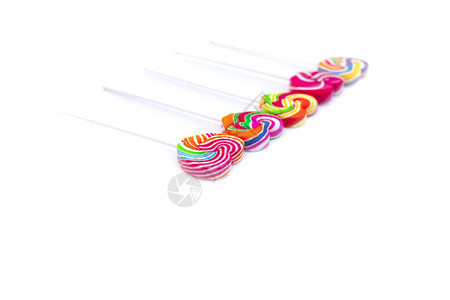 美丽的甜糖心形颜色满白背景彩虹棒糖的果情人节礼物爱概念为了卡片图片