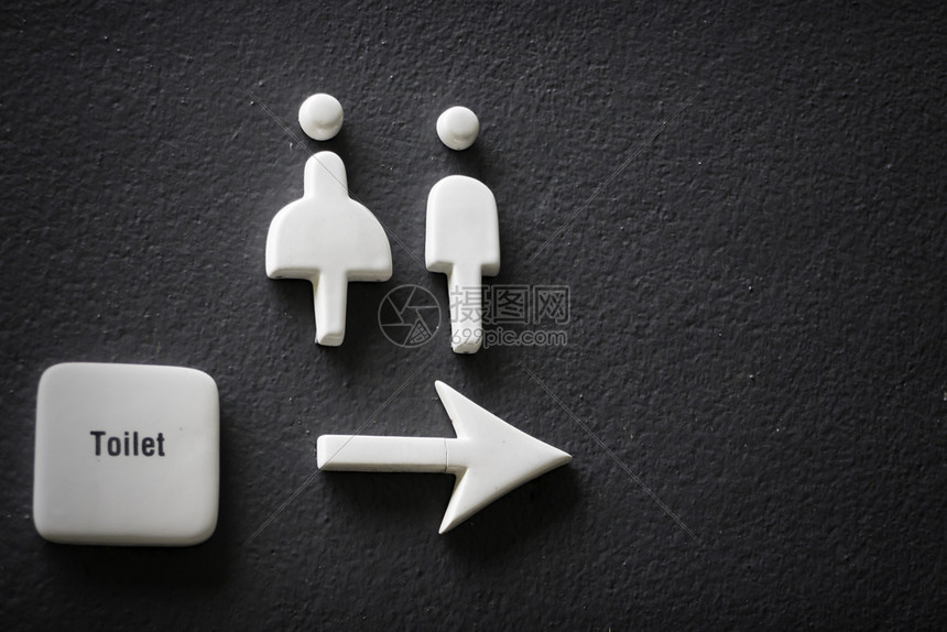 歧视建造男人和女在黑混凝土墙上的标志图片