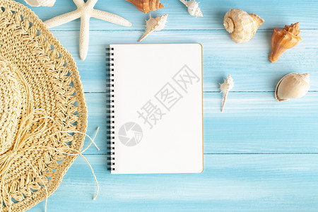 木头蓝板上空白笔记本海壳和蓝木背景上的海星顶部视图夏季概念海洋自然图片