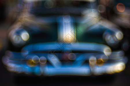 模糊闪耀具有散景焦经典汽车的抽象背景彩色复古汽车具有制空间的散景背特写视图具有气泡散景效果的老式汽车细节特写视图具有气泡散景效果图片