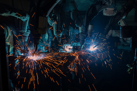 排手臂团队机器人在汽车厂焊接生产图片