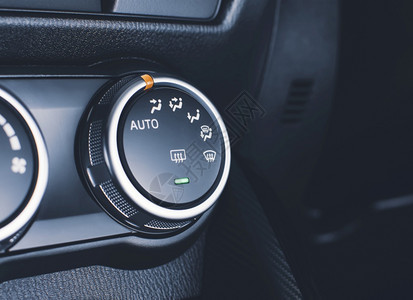 控制汽车仪表板上的空调系统选择按钮开关键自动的乐器图片