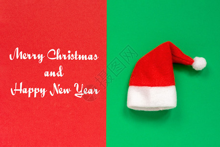 圣诞节霜双色快乐和新年红圣诞老人帽子红色双调绿背景高端观光卡片圣诞快乐和新年红圣诞老人帽子图片