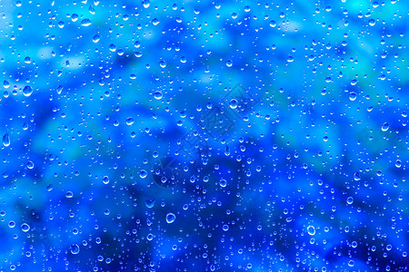 水色抽象蓝背景上的水滴纹理抽象蓝色背景纹理上的水滴健康抽象图片