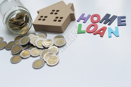 成功投资者生长HomeLOAN抵押贷款和有复制空间的泰国地产硬币概念图片