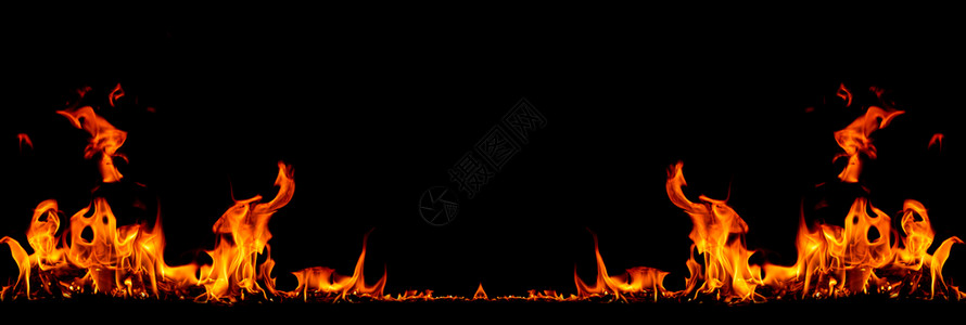 在黑色背景的火焰中燃烧红色热火花升起橙发光的飞行颗粒美丽质地力量图片