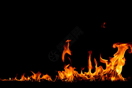 抽象的在背景火焰中燃烧红色热火花升起橙发光的飞行颗粒温暖图片
