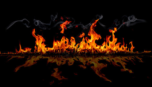 在背景的火焰中燃烧红色热火花升起橙发光的飞行颗粒辉光抽象图片