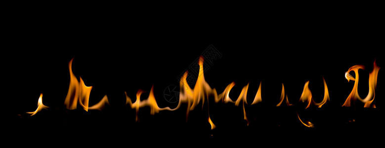 黄色的运动灾难抽象艺术黑色背景的火焰燃烧红色热火花上升烈橙光闪耀的飞行粒子图片