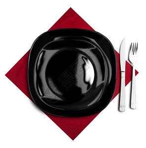 桌子晚餐布蓝色巾纸上的黑板叉和刀图片