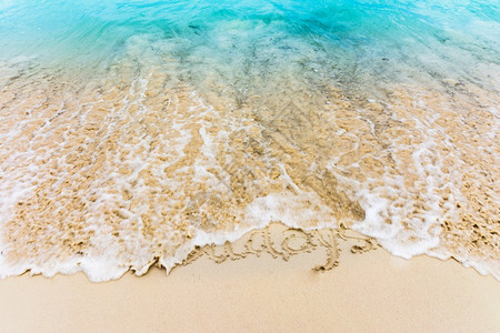 明亮的岛在多米尼加蓬塔卡纳巴瓦罗海滩的沙上抽取假日颜色图片