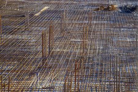 加强型建造具体的施工现场钢筋坯料新建筑钢筋混凝土施工背景图片