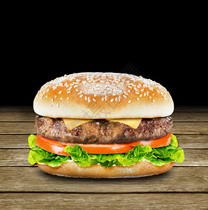 黑色背景前面的汉堡图片
