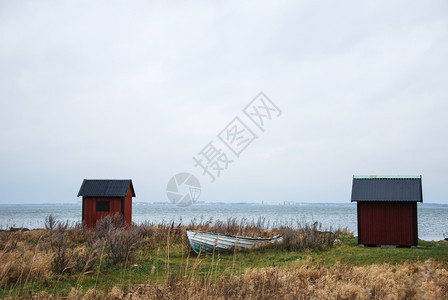 蓝色的户外在波罗海瑞典群岛奥兰海滨废弃的旧捕鱼船渔农村图片