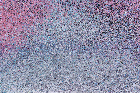溅起创造力画灰金属表面抽象背景纹理上的彩色喷雾涂料图片