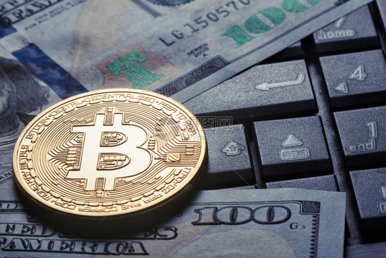 电子商务美元和脑键盘背景下的虚拟货币比特虚拟商业和货币的概念美元和电脑背景下的虚拟货币比特金子矿业图片