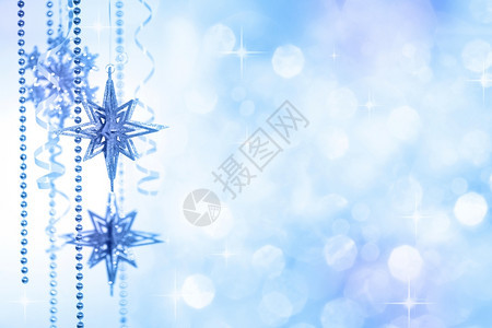垂直的金色散焦背景上的伯利恒圣诞装饰之星发光的复制图片
