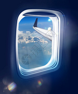 客机内部的空中旅行新黎明从蓝天高空喷气式飞机窗外的亮光照射载体图片