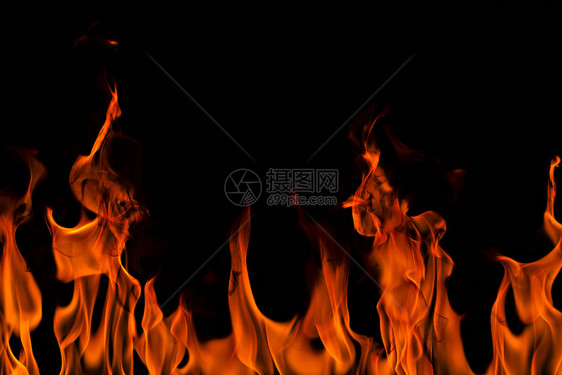 抽象艺术黑色背景的火焰燃烧红色热火花上升烈橙光闪耀的飞行粒子壁炉发光的黄色图片