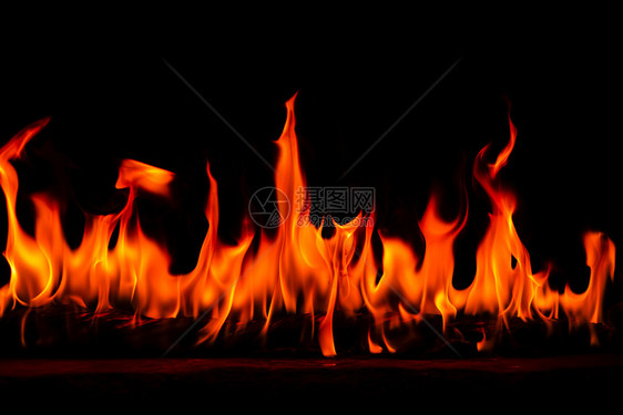 炽烈质地抽象艺术黑色背景的火焰燃烧红色热火花上升烈橙光闪耀的飞行粒子火热图片