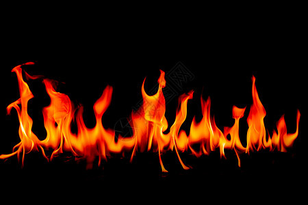 温暖的点燃高抽象艺术黑色背景的火焰燃烧红色热火花上升烈橙光闪耀的飞行粒子图片