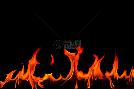 力量抽象艺术黑色背景的火焰燃烧红色热火花上升烈橙光闪耀的飞行粒子壁炉质地图片