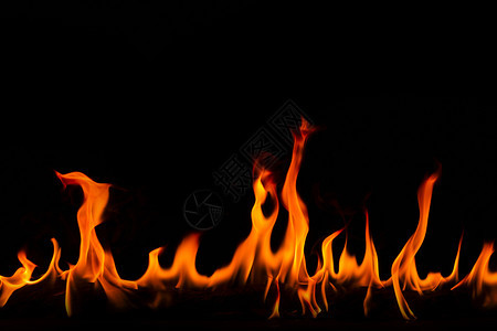 热的温暖抽象艺术黑色背景的火焰燃烧红色热火花上升烈橙光闪耀的飞行粒子冒险图片