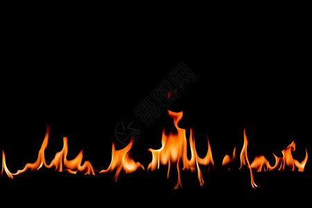 抽象艺术黑色背景的火焰燃烧红色热火花上升烈橙光闪耀的飞行粒子活力温暖的图片