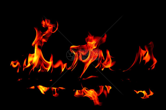 易燃热的质地抽象艺术背景的火焰燃烧红色热火花上升烈橙光闪耀的飞行粒子图片