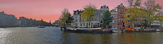 风景优美反射日落时荷兰阿姆斯特丹市风景老的图片