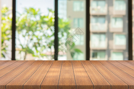 柜台绿色模糊背景复制空间上的木板用于对您的产品或设计进行补装的空纸布位抽象背景模糊的空白棕色板的图片