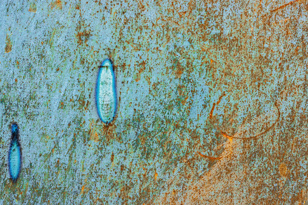 腐蚀蓝色的肮脏具有生锈和斑点背景纹理的旧金属表面图片