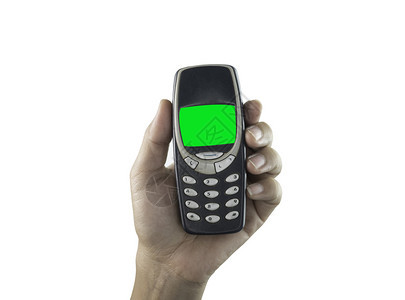 蜂窝近距离紧贴手持在白色背景中被孤立的手机经典指图片