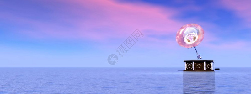 以粉红和蓝色日落背景为本型的老式留声机梦反射器乐的图片