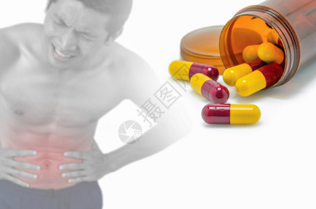 胃治愈维他命抗生素红色和黄本底腹部疼痛模糊肖像疾病药物概念致图片