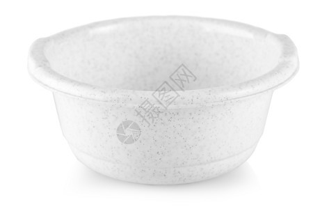 白色塑料碗在底杯子上隔绝的白色塑料碗里面有水闪亮的纸晚餐图片